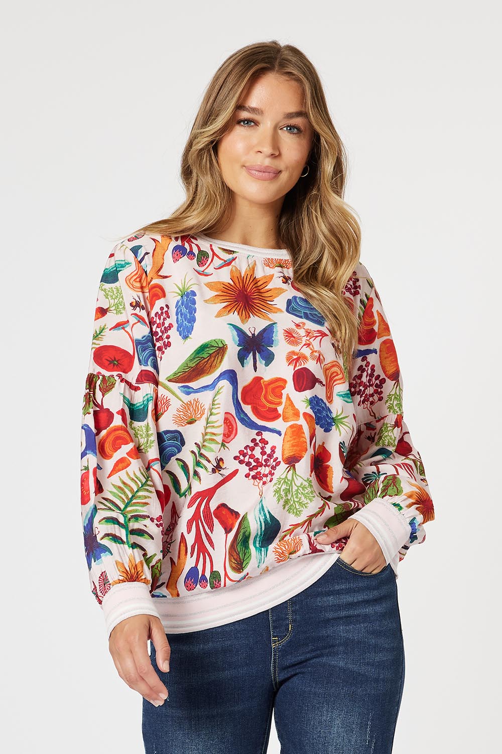 A model wearing the Rio Top in colour Multi (Pink), from the front, cropped image