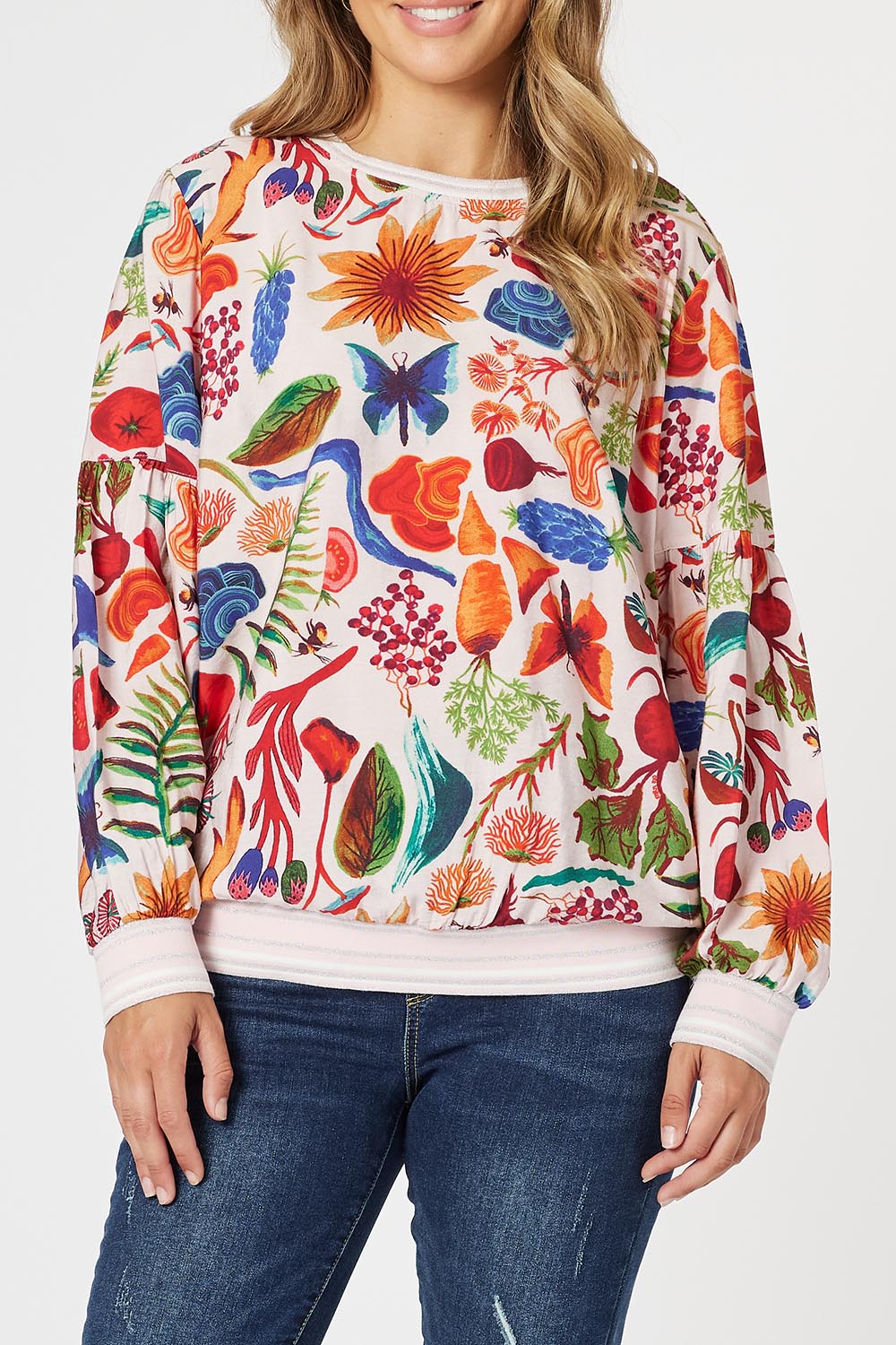 A model wearing the Rio Top in colour Multi (Pink), from the front, cropped image