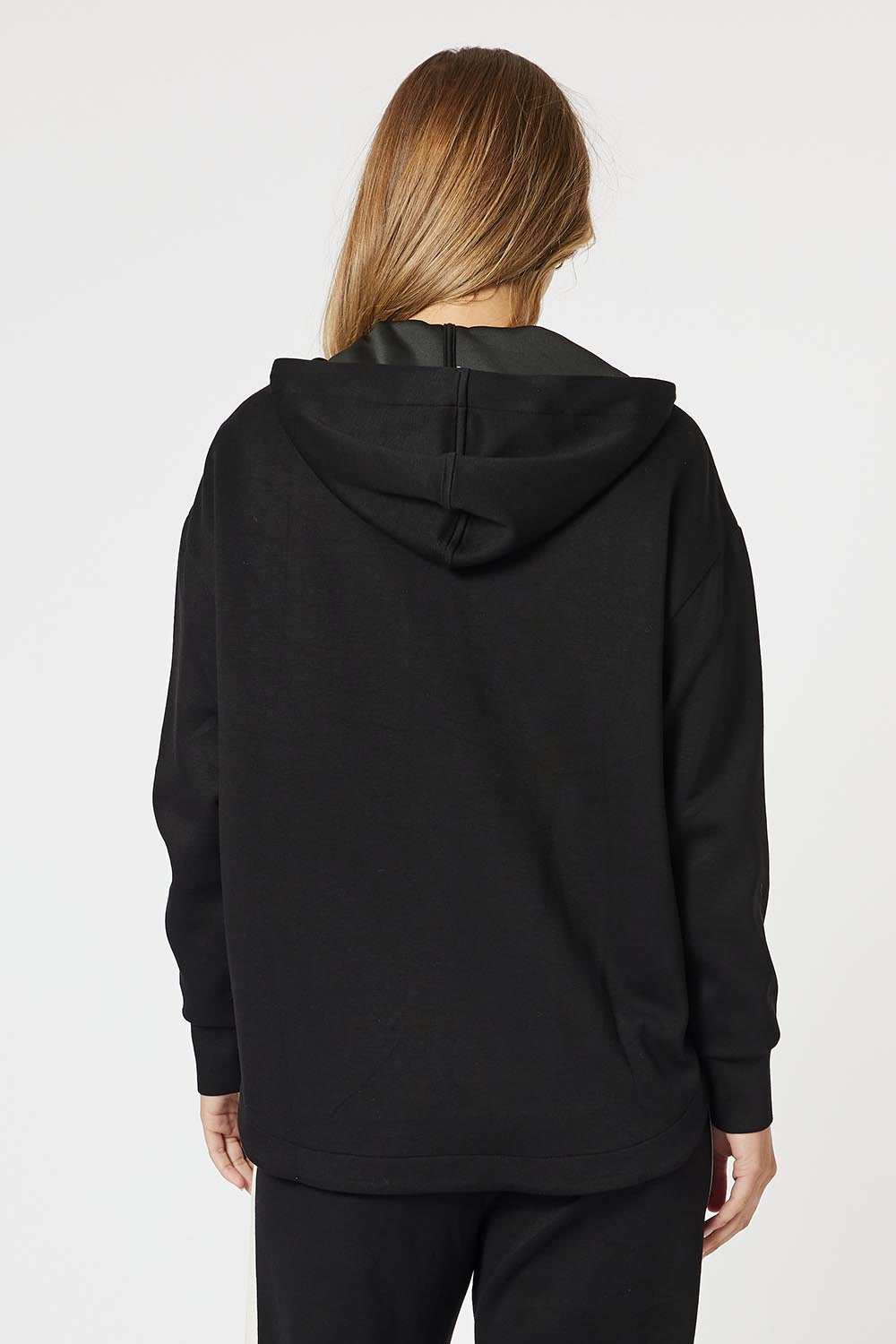 A model wearing the Evie Sweatshirt in colour Black (Black), from the back