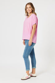 A model wearing The Sienna Linen Blend Tee in colour Pink (Pink), from the front, showing the whole outfit