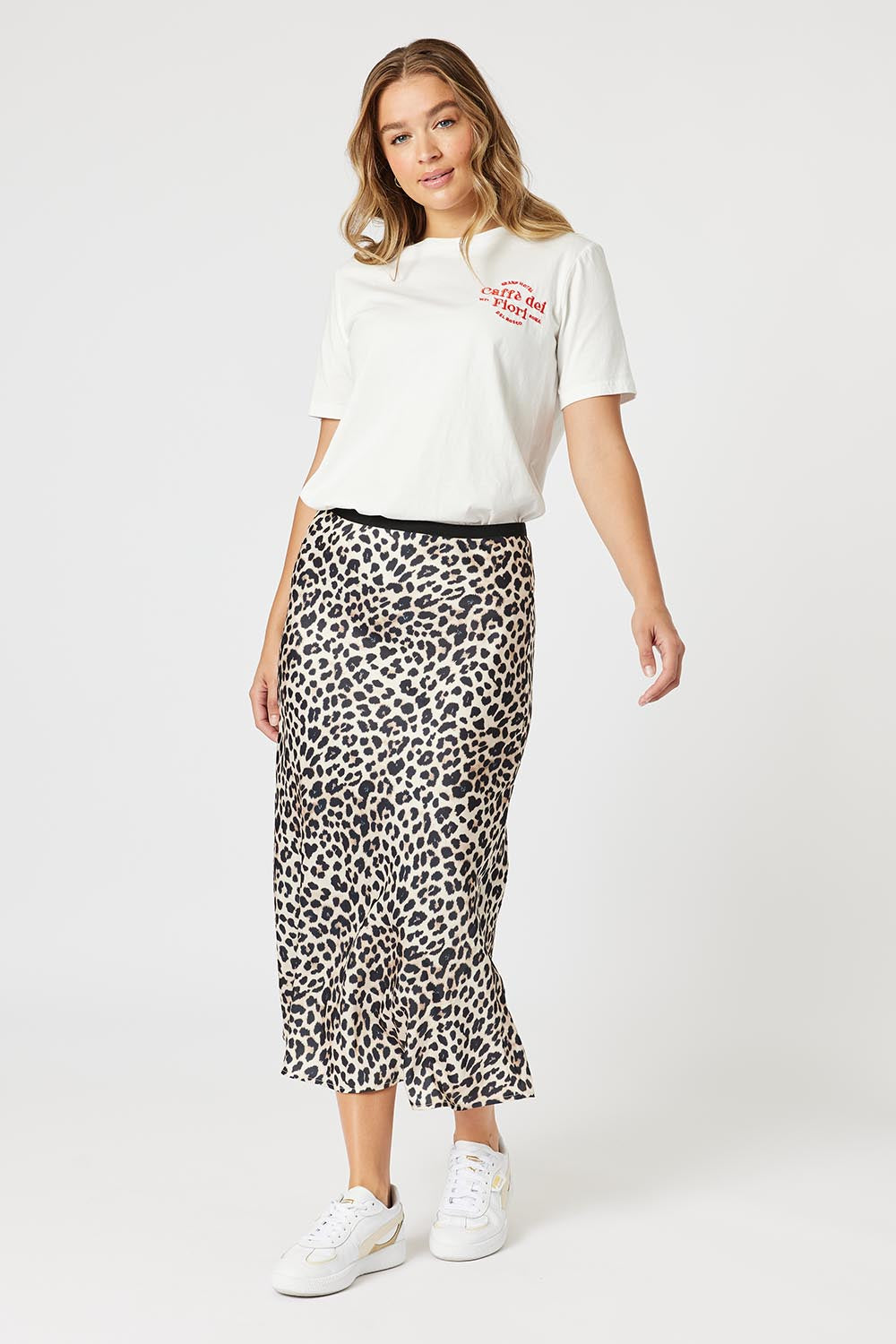 A model wearing the Caffe Cotton Tin colourShirt - Ivory (White), from the front, showing the whole outfit