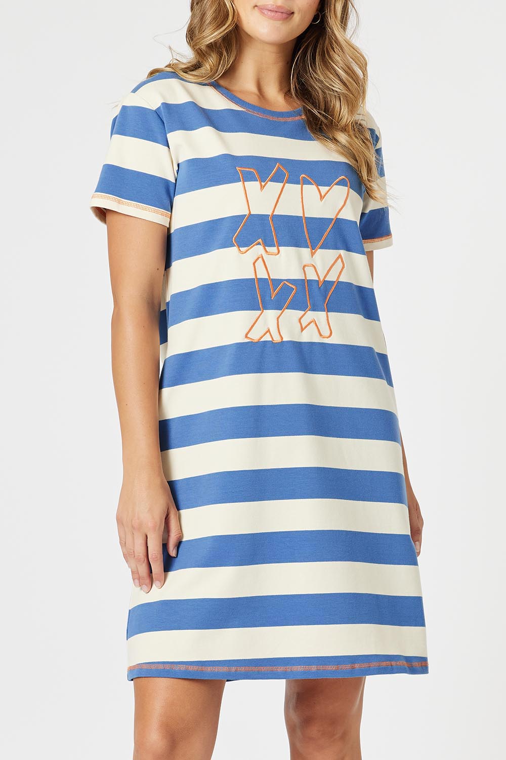A model wearing the Love & Kisses Cotton Dress in colour Blue (Blue), from the front, cropped image