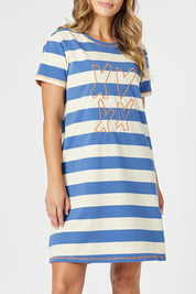 A model wearing the Love & Kisses Cotton Dress in colour Blue (Blue), from the front, cropped image