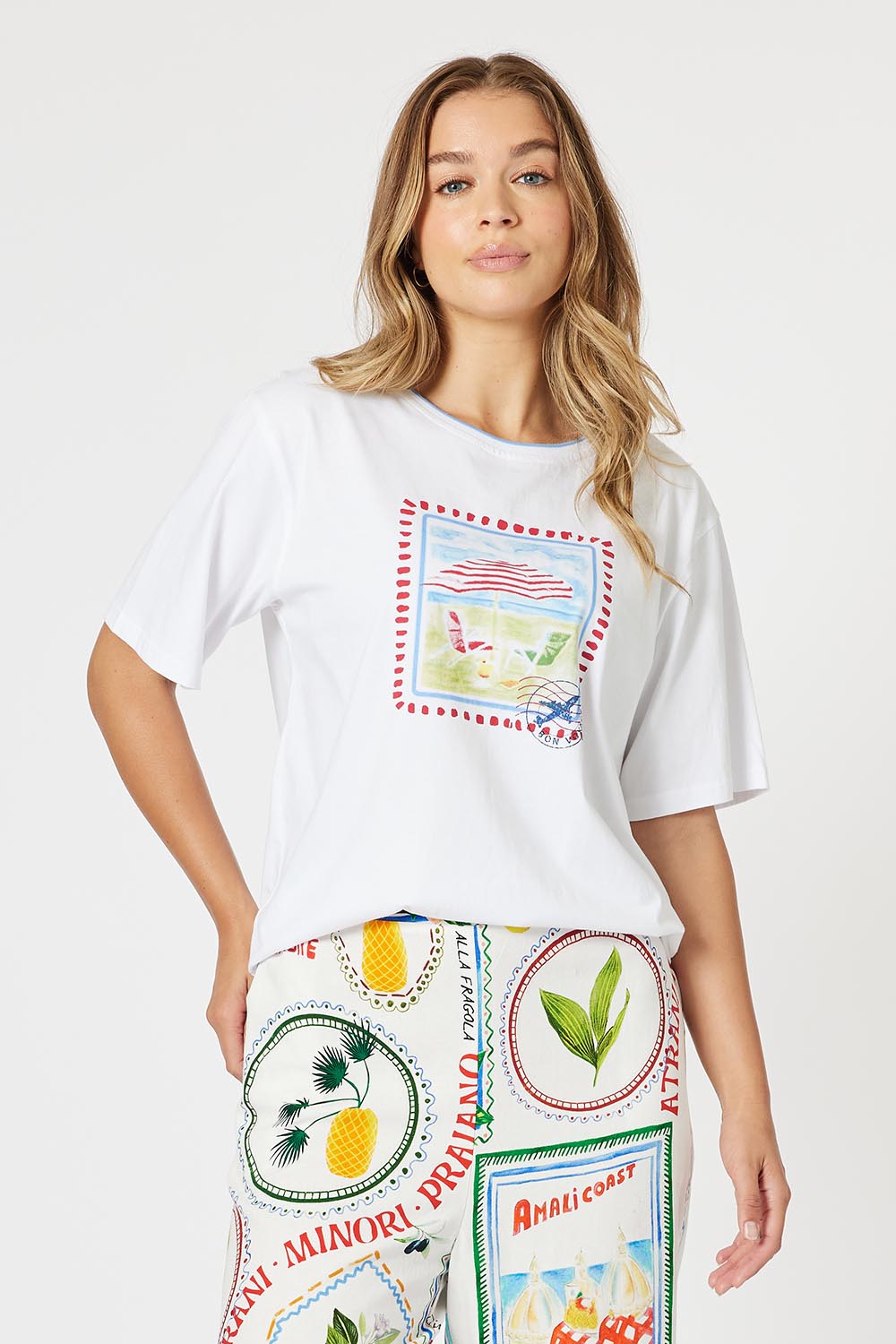 A model wearing the Amalfi Cotton Tee in colour White (White), from the front, cropped image