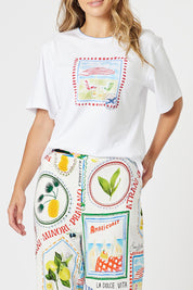 A model wearing the Amalfi Cotton Tee in colour White (White), from the front, cropped image
