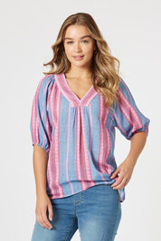 A model wearing the Bloom Stripe Cotton Top in colour Indigopink, from the front, cropped image