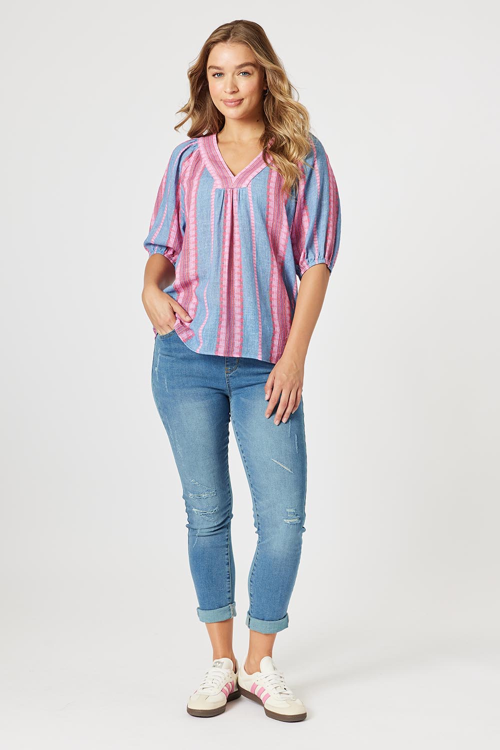 A model wearing the Bloom Stripe Cotton Top in colour Indigopink, from the front, showing the whole outfit
