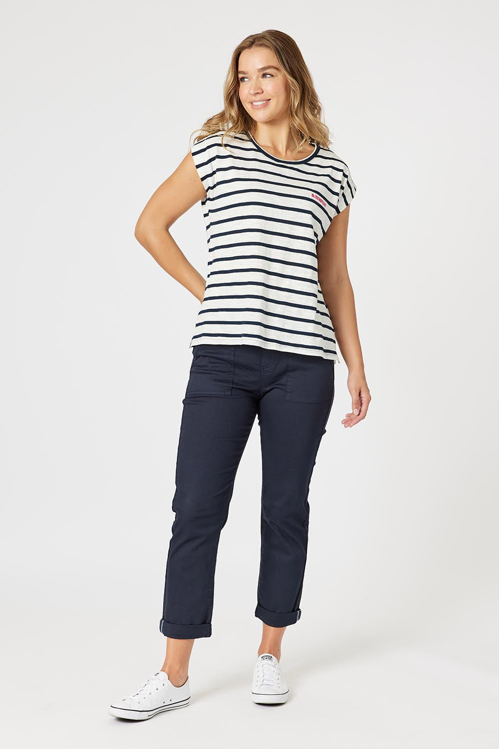 A model wearing the Isabella Cotton Pant in colour Navy (Blue), from the front, showing the whole outfit