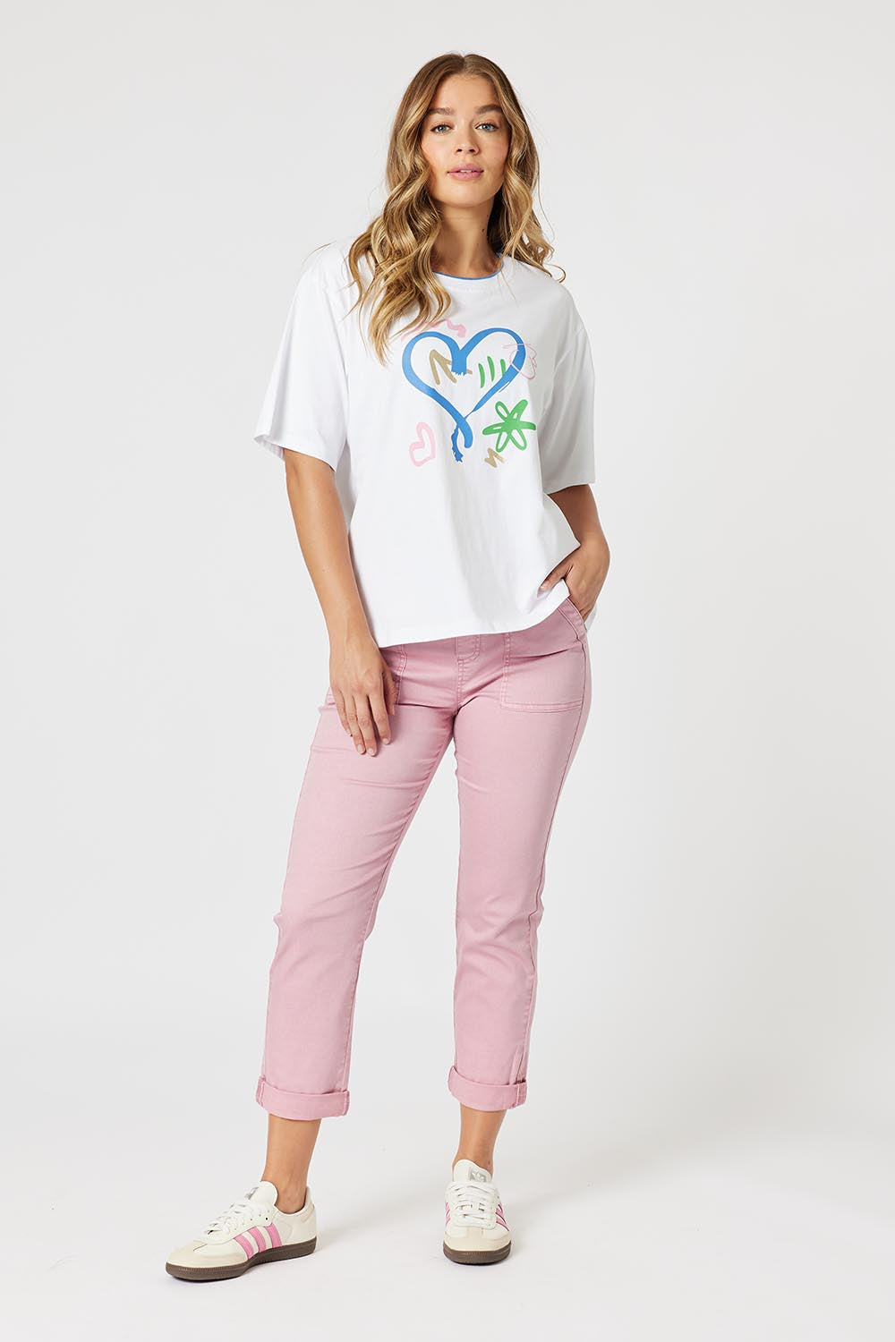 A model wearing the Heart Printed Cotton Tee in colour White (White), from the front, showing the whole outfit