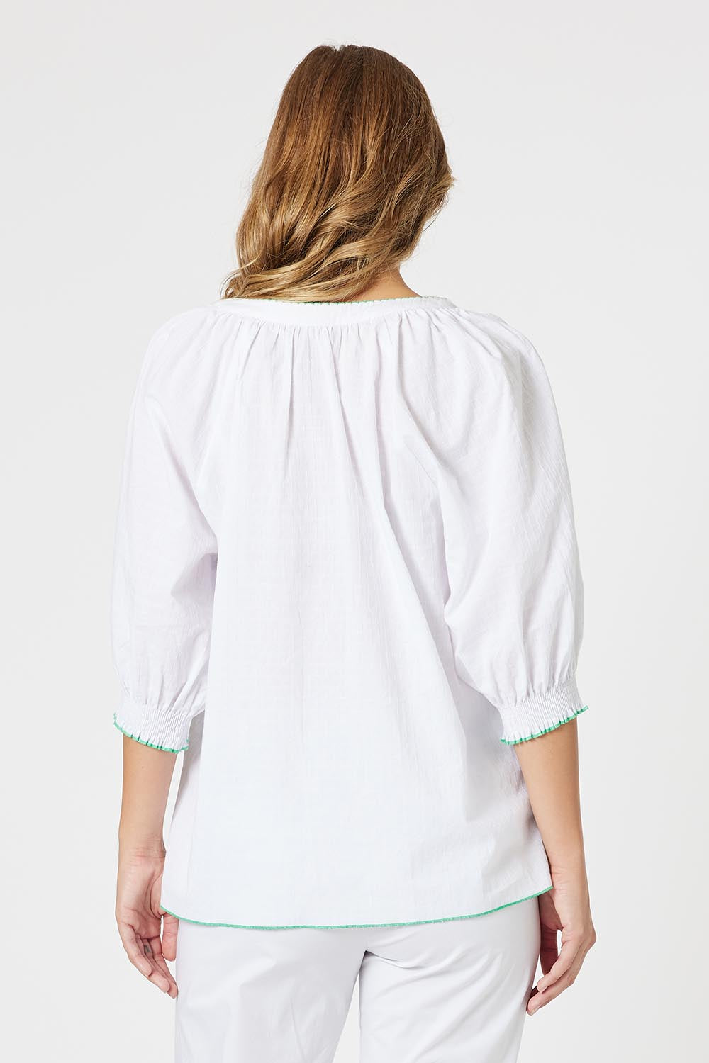 A model wearing the Pina Colada Embroidered Cotton Top in colour White (White), from the back
