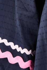 Product shot of the Ric Rac Cotton Top in colour Navy (Blue), detail
