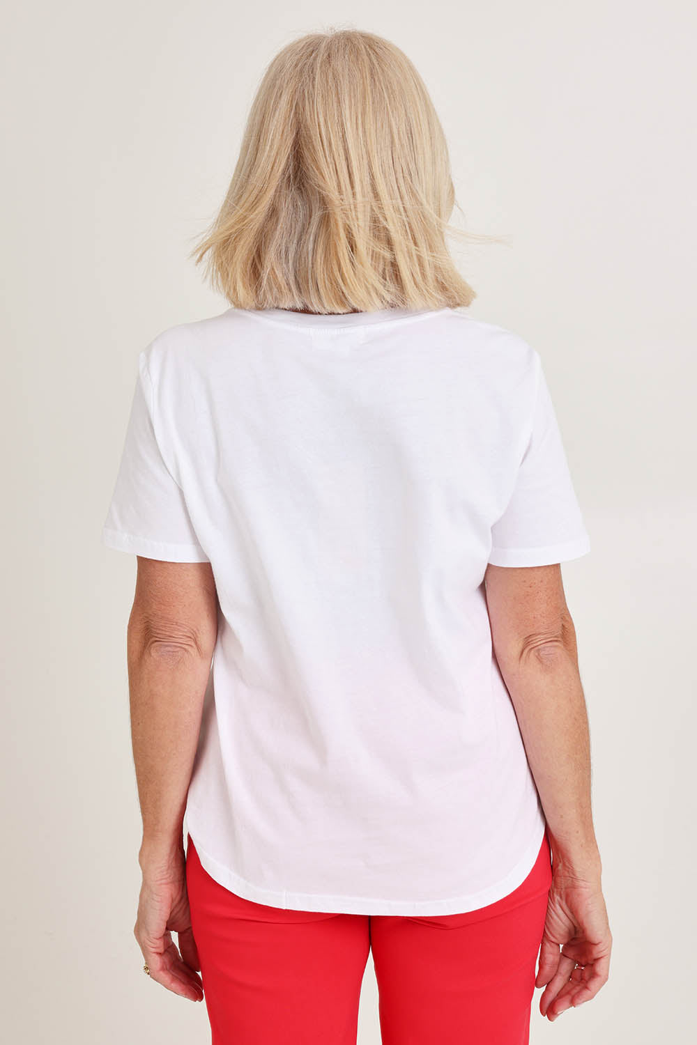 Model Sandy wearing size S of the Sequin Christmas Tree Cotton Tee in colour White (White), from the back