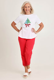 Model Sandy wearing size S of the Sequin Christmas Tree Cotton Tee in colour White (White), from the front, showing the whole outfit