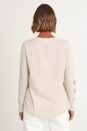 Model Riina wearing size S of the Heart Square Tee in colour Natural, from the back