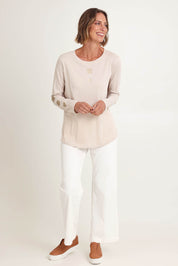 Model Riina wearing size S of the Heart Square Tee in colour Natural, from the front, showing the whole outfit