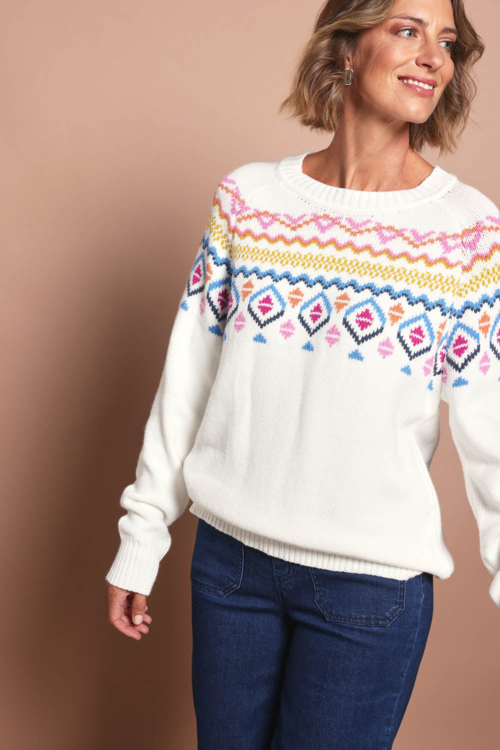 Model Riina wearing size S of the Chevalier Knit in colour Ivory, from the front, cropped image