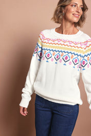 Model Riina wearing size S of the Chevalier Knit in colour Ivory, from the front, cropped image