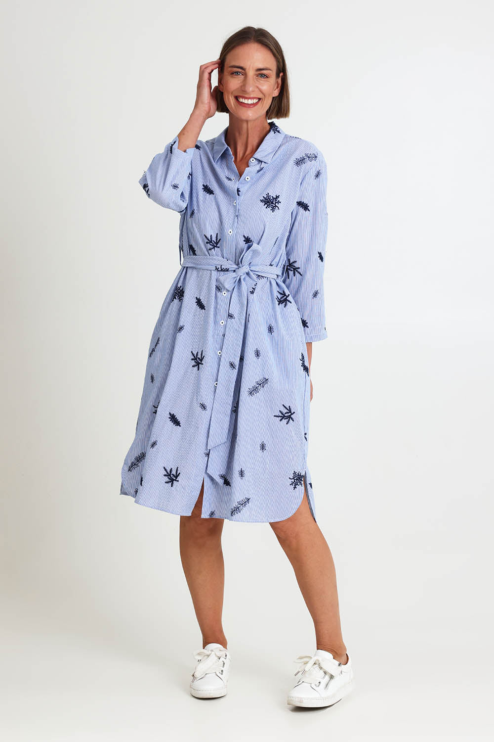 Model Riinar wearing size 10 of the Botanica Shirt Dress – Navy in colour Navy, from the front