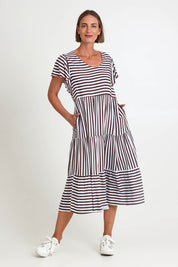 Model Riinar wearing size 10 of the Kalahari Stripe Dress – Coffee in colour Coffee, from the front