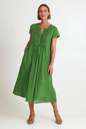 Model Riinar wearing size 10 of the Acacia Cotton Dress – Apple in colour Apple, from the front