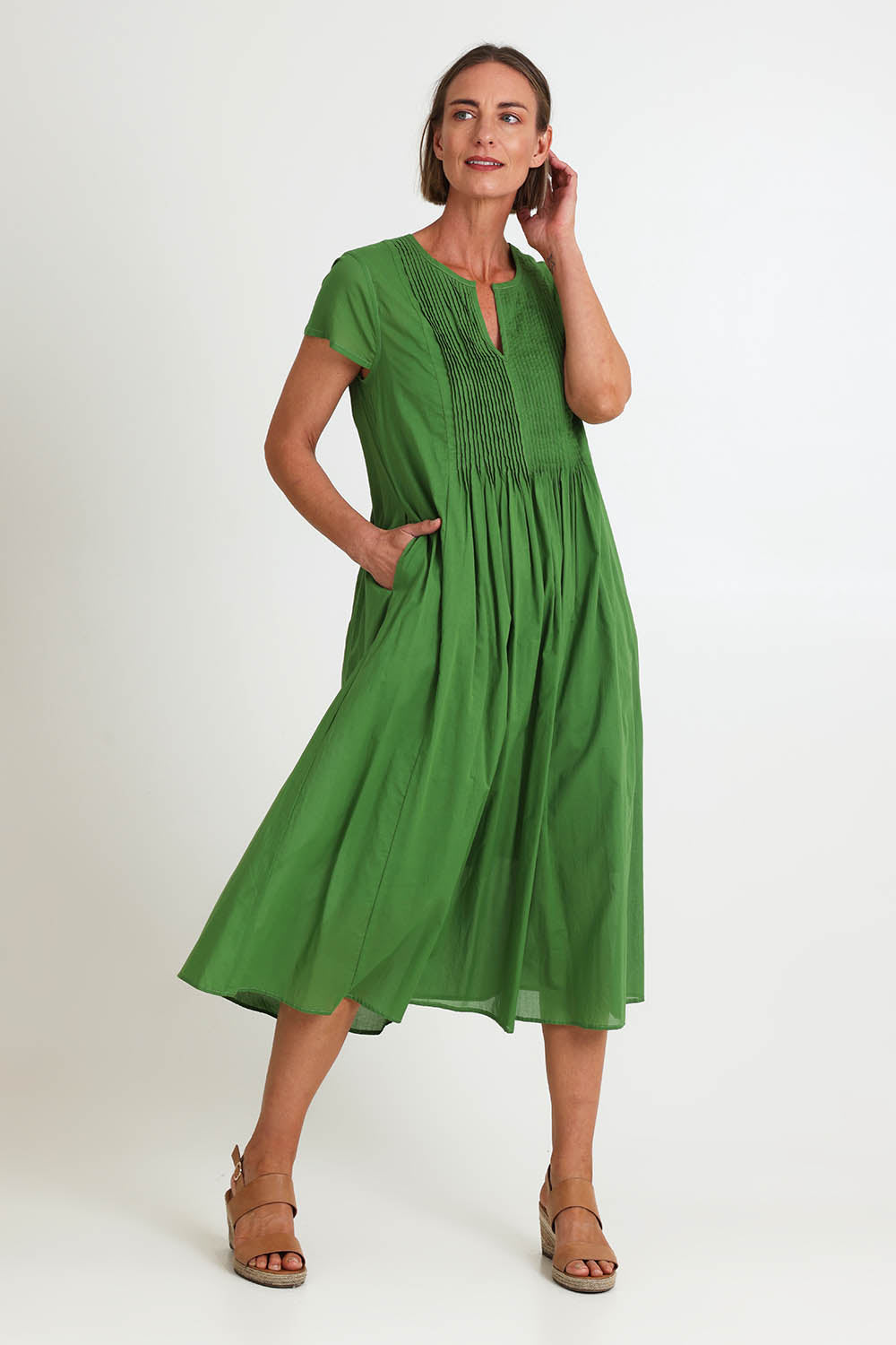 Model Riinar wearing size 10 of the Acacia Cotton Dress – Apple in colour Apple, from the front
