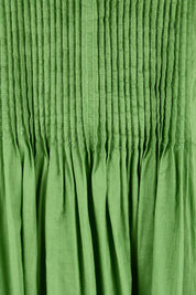 Product shot of the Acacia Cotton Dress – Apple in colour Apple, showing detail