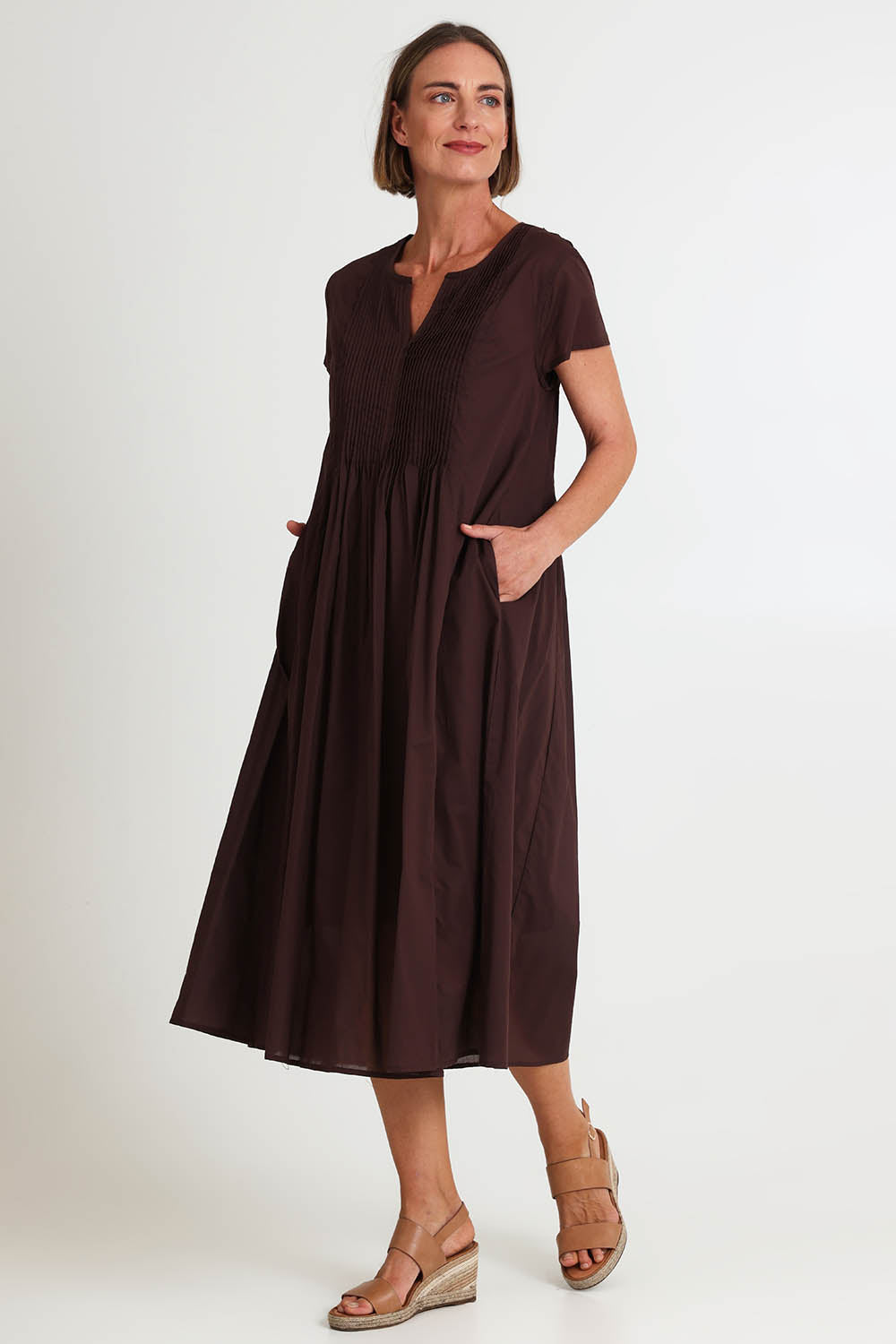 Model Riinar wearing size 10 of the Acacia Cotton Dress – Coffee in colour Coffee, from the front