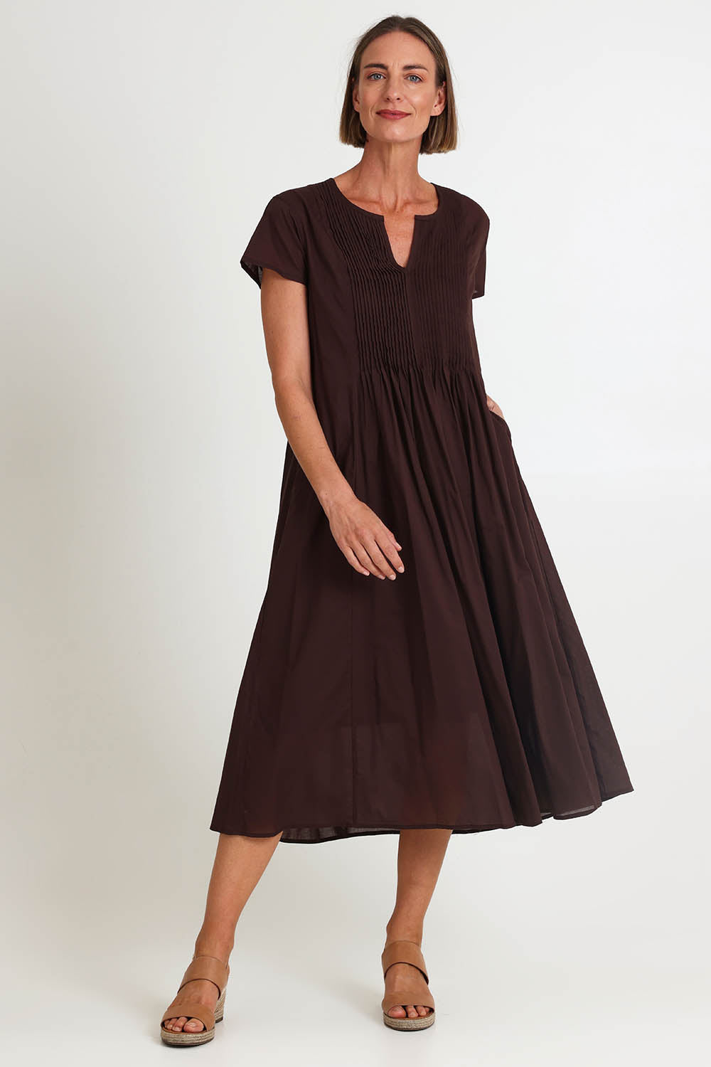 Model Riinar wearing size 10 of the Acacia Cotton Dress – Coffee in colour Coffee, from the front