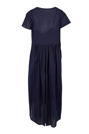 Product shot of the Acacia Cotton Dress – Navy in colour Navy, from the back