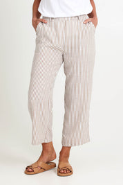 Model Riinar wearing size 10 of the Urban Stripe Pant – Natural in colour Natural, in a cropped view