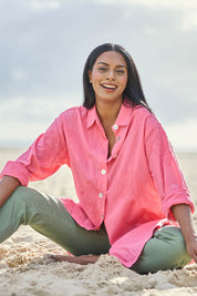 Model Eshan wearing size 10 of the Lagoon Palm Shirt – Raspberry in colour Raspberry, from the front