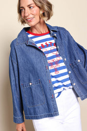 Model Riinar wearing size 10 of the Coast Crop Denim Jacket – Denim in colour Denim, from an angle