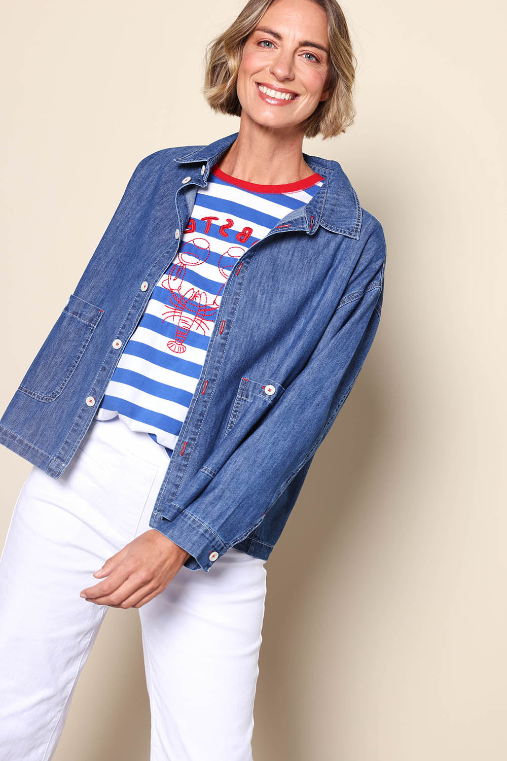 Model Riinar wearing size 10 of the Coast Crop Denim Jacket – Denim in colour Denim, in a cropped view