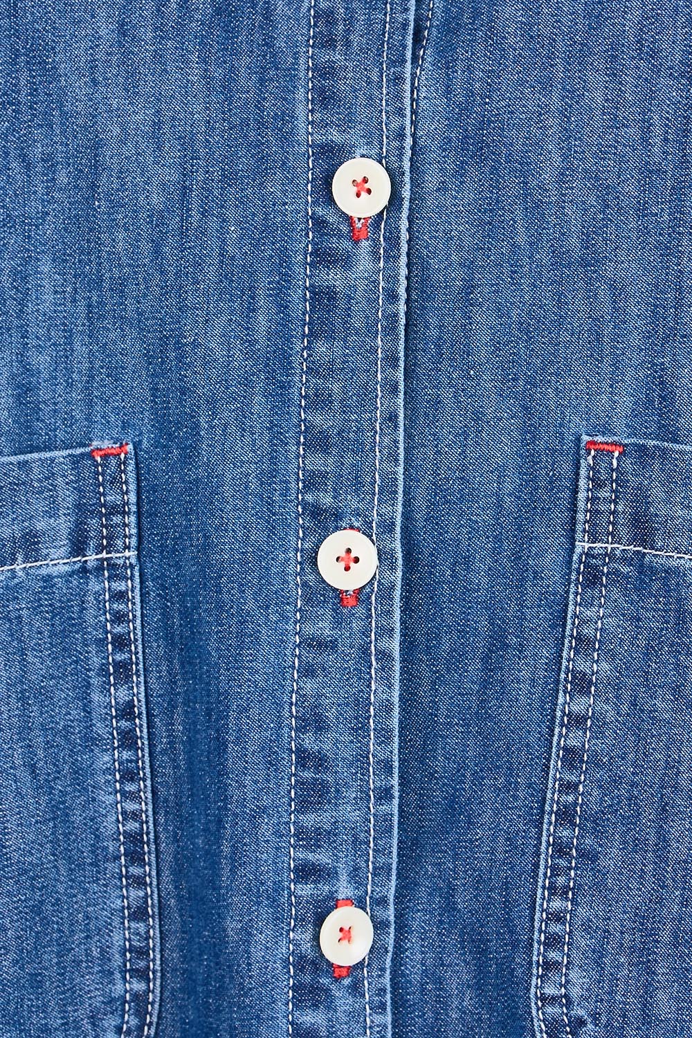 Product shot of the Coast Crop Denim Jacket – Denim in colour Denim, showing detail