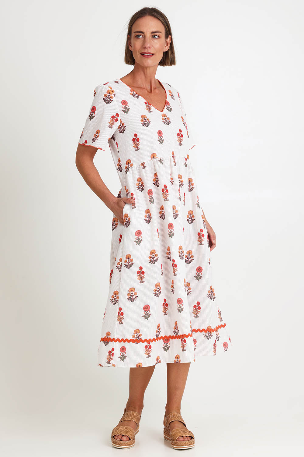 Model Riinar wearing size 10 of the Candelabra Flower Dress – Natural in colour Natural, from the front