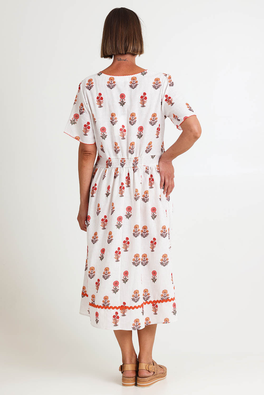 Model Riinar wearing size 10 of the Candelabra Flower Dress – Natural in colour Natural, from the front