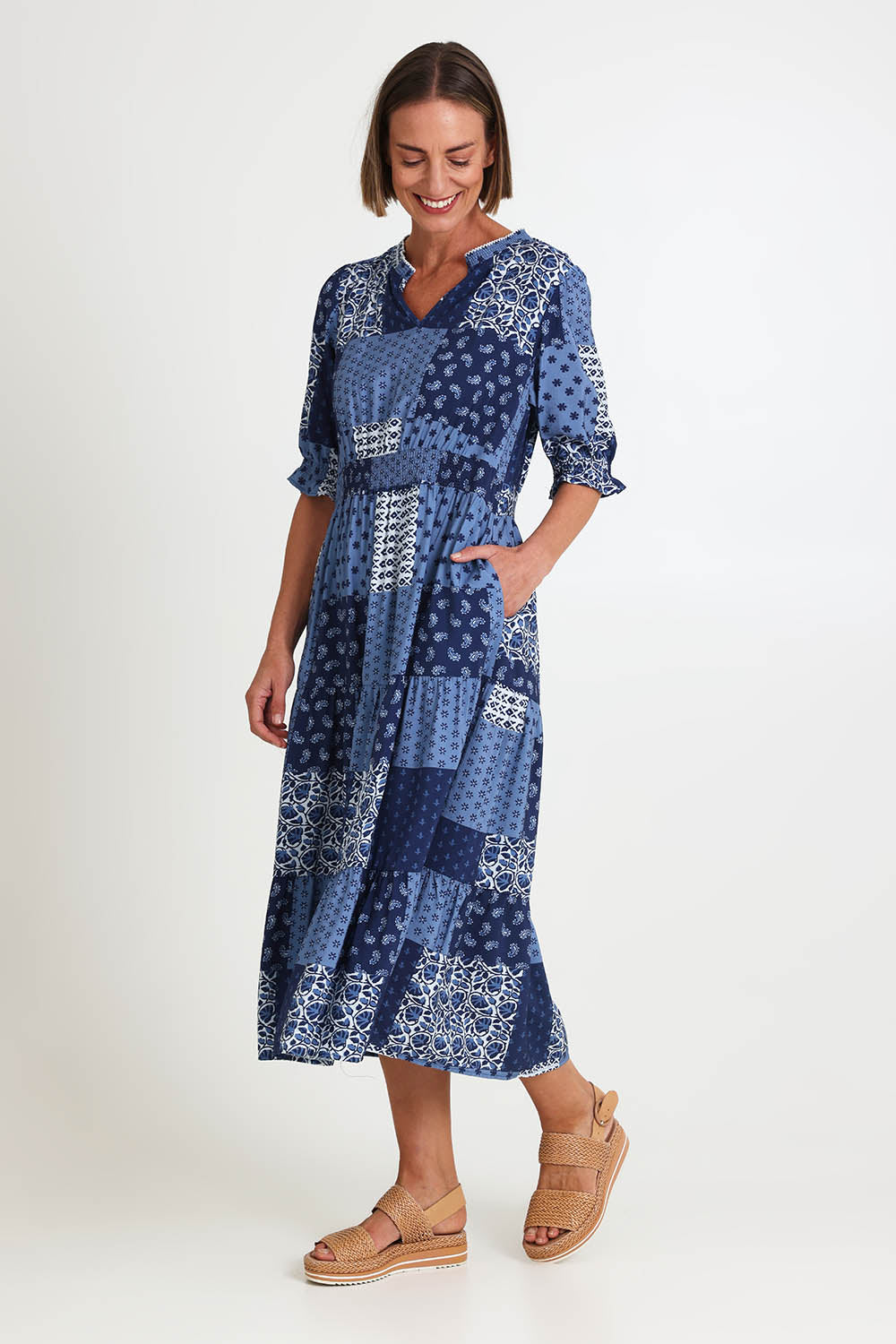 Model Riinar wearing size 10 of the Costa Mesa Print Dress – Navy in colour Navy, from the front
