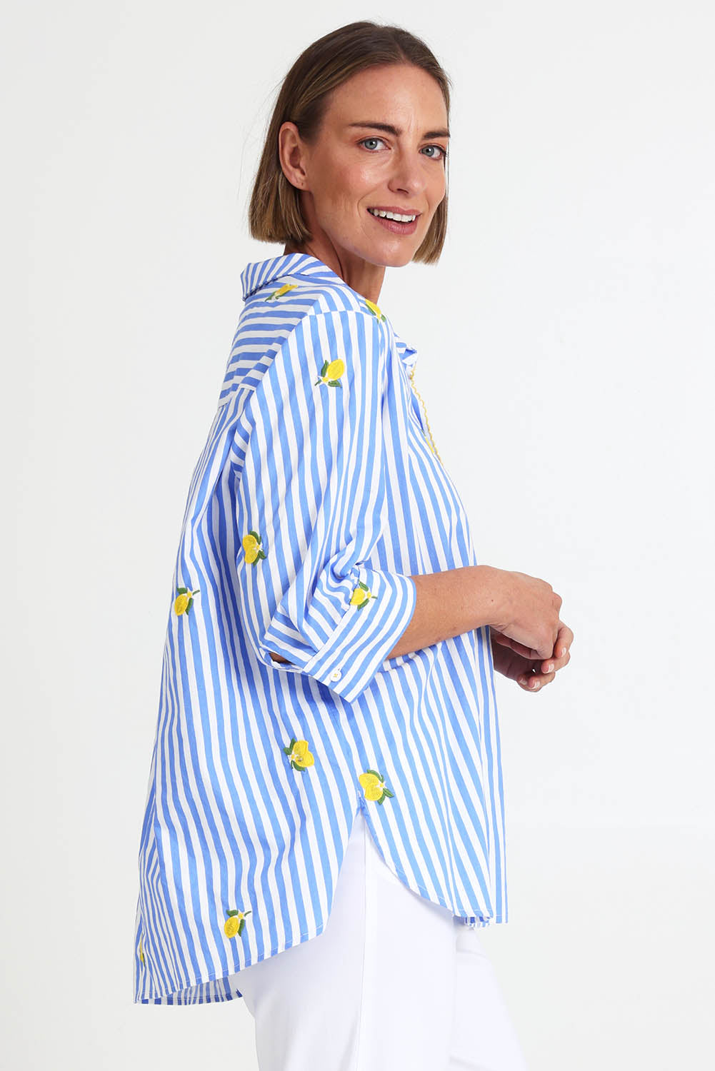 Model Riinar wearing size 10 of the Spritz Stripe Shirt – Bluewhite in colour Bluewhite, from an angle