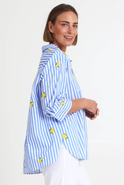 Model Riinar wearing size 10 of the Spritz Stripe Shirt – Bluewhite in colour Bluewhite, from an angle
