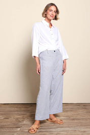 Model Riinar wearing size 10 of the City Stripe Pant - Navywhite in colour Navywhite, from the front