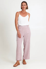 Model Riinar wearing size 10 of the City Stripe Pant - Redwhite in colour Redwhite, from the front