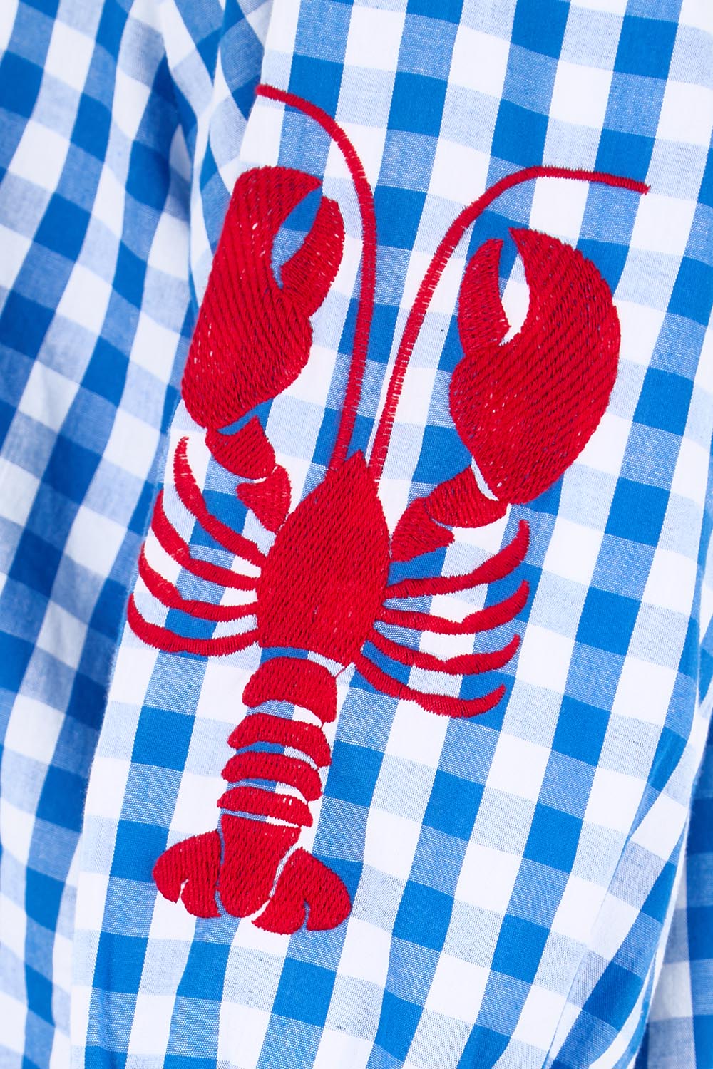 Product shot of the Cove Check Top – Azure in colour Azure, showing detail
