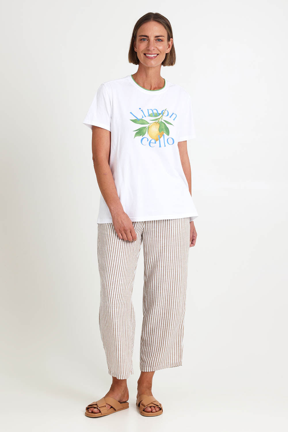 Model Riinar wearing size 10 of the Limoncello Tee – White in colour White, from the front