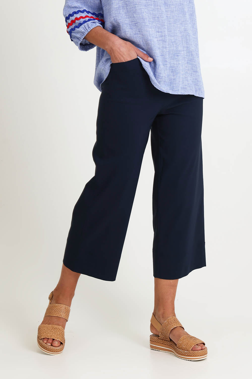 Model Riinar wearing size 10 of the Zara Wide Leg Pant - Navy in colour Navy, from an angle