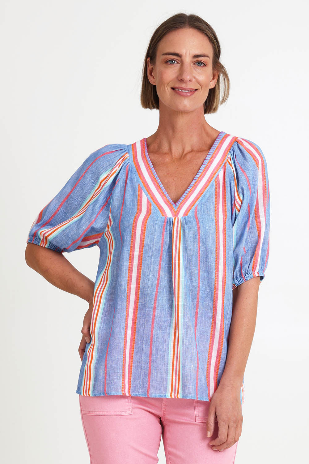 Model Riinar wearing size 10 of the Laguna Stripe Top – Denimmulti in colour Denimmulti, in a cropped view