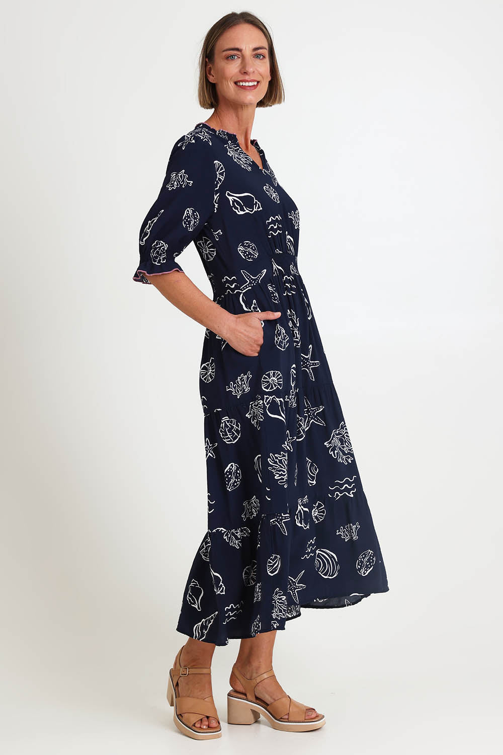 Model Riinar wearing size 10 of the Montecito Print Dress – Navy in colour Navy, from the front