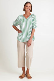 Model Riinar wearing size 10 of the Kalahari Stripe Top – Apple in colour Apple, from the front