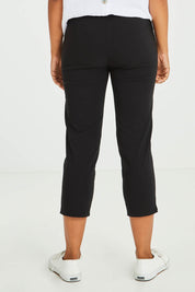 Model Olivia wearing size S of the Zara Pant in colour Black (Black), from the back