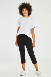 Model Olivia wearing size S of the Zara Pant in colour Black (Black), from the front, showing the whole outfit