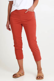 Model Riinar wearing size 10 of the Zara Pant - Ginger in colour Ginger, in a cropped view